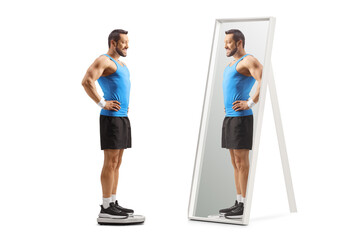 Fit strong man in sportswear standing on a weight scale and looking at a mirror