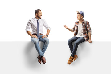 Teenager and a businessman sitting on a panel and having a conversation