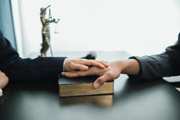 A Bible is placed on the table in the law office so that the defendant can swear before the Bible that he will testify truthfully and with the power of faith in God that the defendant will not lie.