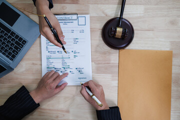 client meets with a lawyer within the legal counsel office to request advice about law and lawsuit...