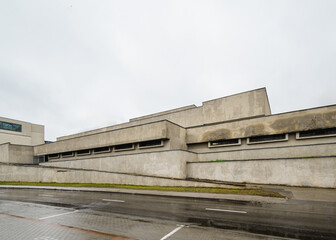 Brutalist Concrete Building on Rainy Day