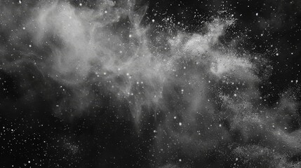 Obraz premium Abstract Dust Explosion in Black Background, black background , white dust , abstract , explosion