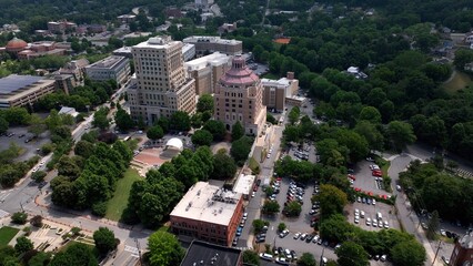 City skyline of Asheville, NC at the base of the Blue Ridge Mountains in North Carolina, a living and vacation destination in the Southern, United States showing architecture of buildings and streets