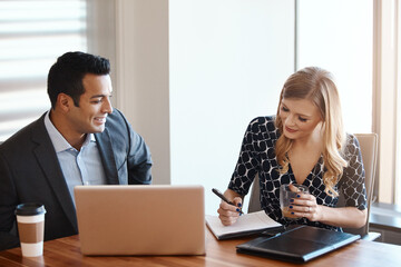 Obraz premium Businessman, woman and writing with laptop in office for real estate partnership, meeting and communication on due diligence. Investors, tech and talk on return of investment and property valuation.