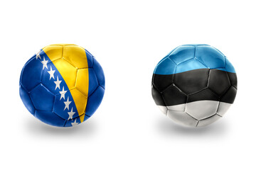 football balls with national flags of estonia and bosnia and herzegovina,soccer teams. on the white background.