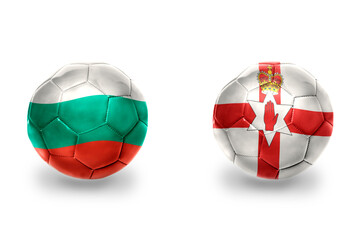 Obraz premium football balls with national flags of northern ireland and bulgaria ,soccer teams. on the white background.