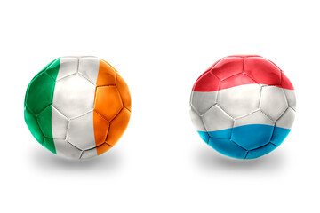 football balls with national flags of luxembourg and ireland ,soccer teams. on the white background.