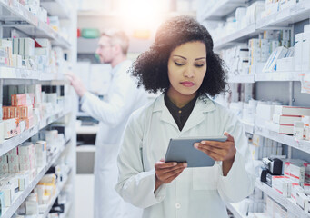 Healthcare, stock and woman in pharmacy with tablet, checklist and online sales in drug store. Reading, research and pharmacist with digital app for prescription medicine, info and health insurance