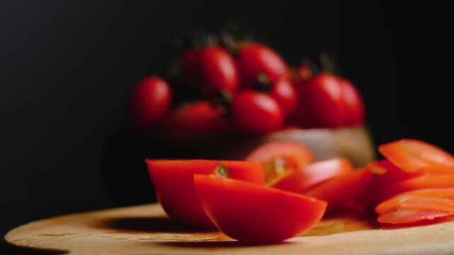 cut a tomato on a black background