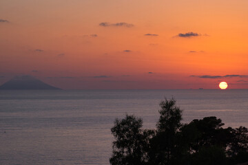 Sunset in Calabria Italy, with Stromboli volcano in the background