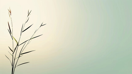 Obraz premium Tall blades of grass swaying in the wind against a soft, blurred background of sky and water. Concept of nature, tranquility, and peace.