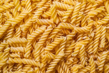 Flat lay photography of raw fusilli pasta as a textured background, ideal for creative designs