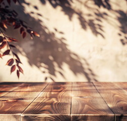 Naklejka premium Wooden table top mockup on plant shadow wall background and autumn tree with leaves. For product presentation, display, podium. Template. Copy space. Mocha Mousse pantone color 2025