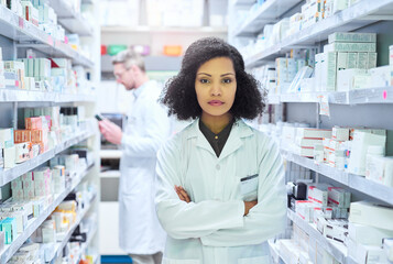 Healthcare, confidence and portrait of woman in pharmacy with pride, advice and about us in drug store. Serious, arms crossed and pharmacist with wellness, prescription medicine and health insurance