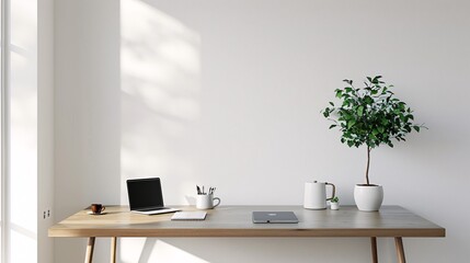 Minimalist home office desk with laptop and coffee cup