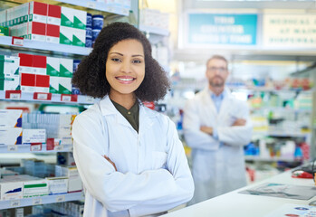 Healthcare, smile and portrait of woman in pharmacy with service, advice and happy in drug store. Confidence, arms crossed and pharmacist with wellness, prescription medicine and health insurance