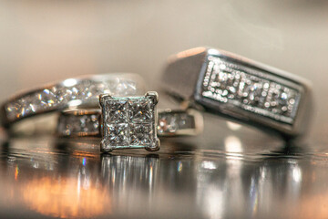 Stunning set of three silver wedding bands with diamonds stacked on top of each other