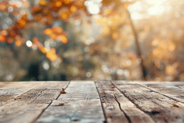 Wooden table with autumn decoration, pumpkins, maple leaves and corns on blurred nature background