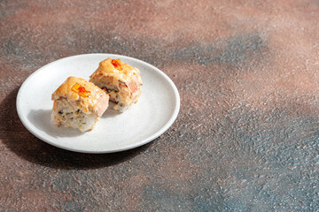 sushi is a Japanese dish of prepared vinegared rice, usually with some sugar and salt, accompanied by a variety of ingredients such as seafood, often raw and vegetables.