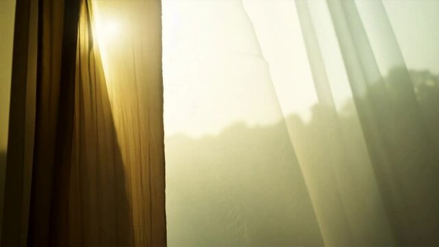 Bright morning sun in the open window through the curtains