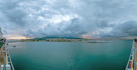 Panoramic view of Palma de Mallorca with cathedral from the harbor with storm clouds