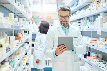 Man, pharmacy and tablet with reading for inventory, stock or drugs for order from supplier....