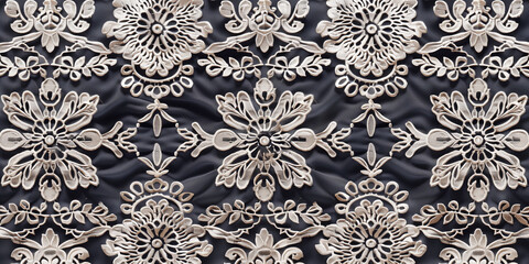 White lace embroidery on black background