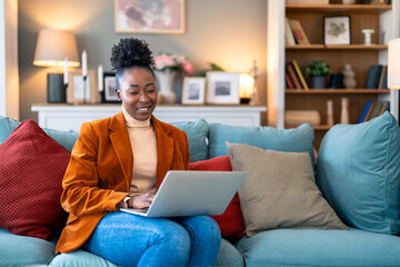 Smiling young woman business manager discussing ideas over laptop during online meeting at home office.