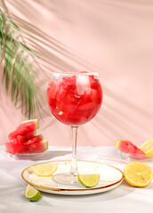 Watermelon frozen cocktail with fresh slices of watermelon, lime and mint, summer party and vacation concept, bar advertising, cafe, selective focus.