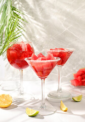 Various Watermelon frozen cocktails with fresh slices of watermelon, lime and mint, summer party and relaxation concept, advertising for bar, restaurant, cafe, selective focus.