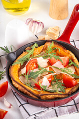 Homemade breakfast savory dutch baby pancake, Portioned frying pan with vegan  savory dutch baby...