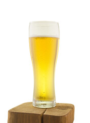 glass mug with golden fresh beer on wooden stand isolated on white