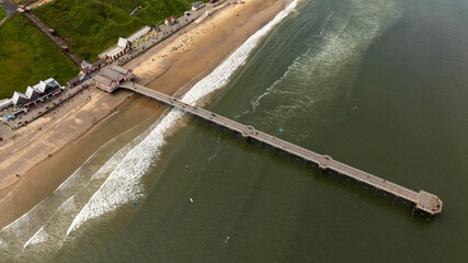 Aerial View of Saltburn Pier.Saltburn by the Sea has maintained much of its original charm as a Victorian seaside resort including its pier, the colourful Italian Gardens and walks through Riftswood. 