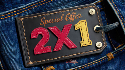 Black leather tag with the words Special Offer two for one in red and yellow letters, sewn onto a pair of blue jeans. Represents a discount promotion.