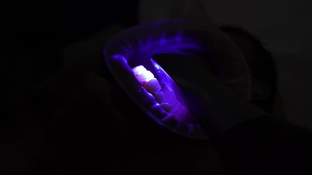 Dental intraoral scanner used by orthodontist in stomatology clinic 4k video. Doctor examines teeth of patient with x-ray scanning equipment.