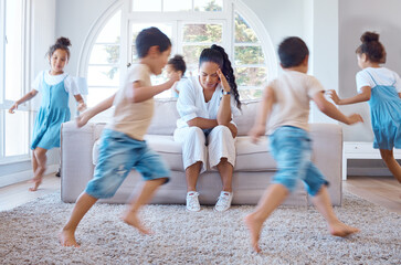 Frustrated mother, children and depression with chaos, hyperactive or adhd kids in living room at...