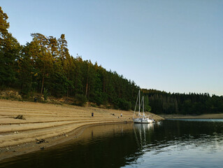 Two yachts waiting by the beach