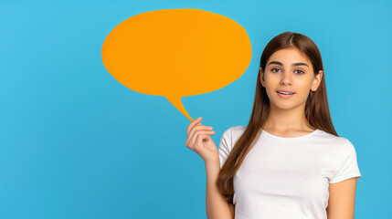 Young Woman Holding Orange Speech Bubble on Blue Background. Conceptual Communication and Creative Message Display