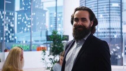 Portrait of happy financial advisor meeting with clients to recommend financial products and...