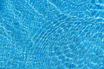 Beautiful blue water surface of a swimming pool , top shot