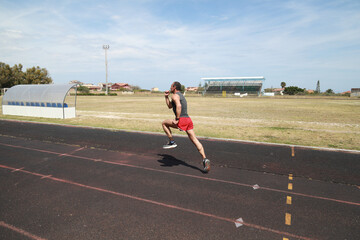 Fototapeta premium The Runner Sprint In The Athletic Track 