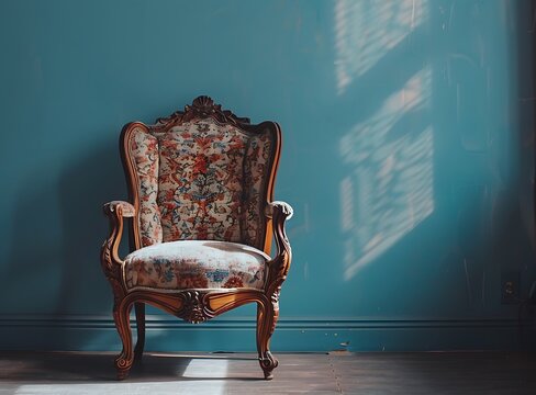 old vintage baroque style armchair on the floor in empty room with blue wall background, vintage furniture, home interior design of modern livingroom , photo taken by Canon r6 mark II