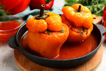 Tasty stuffed peppers on light grey table, closeup