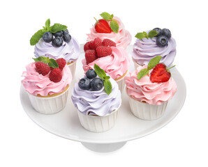 Tasty cupcakes with different berries isolated on white