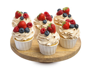 Tasty cupcakes with different berries isolated on white