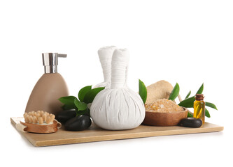 Wooden board with different spa accessories and plant branches isolated on white background