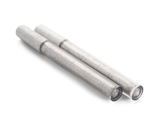 Modern silver mascara on white background