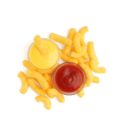 Tasty salty corn sticks and sauces on white background