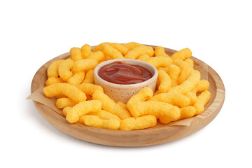 Wooden plate with tasty corn sticks and ketchup on white background