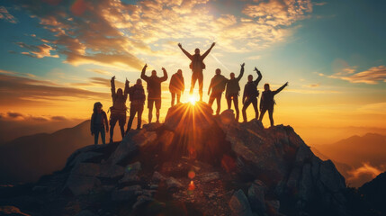 Fototapeta premium Group of hikers celebrating on a mountain peak during sunrise, symbolizing teamwork, achievement, and outdoor adventure.